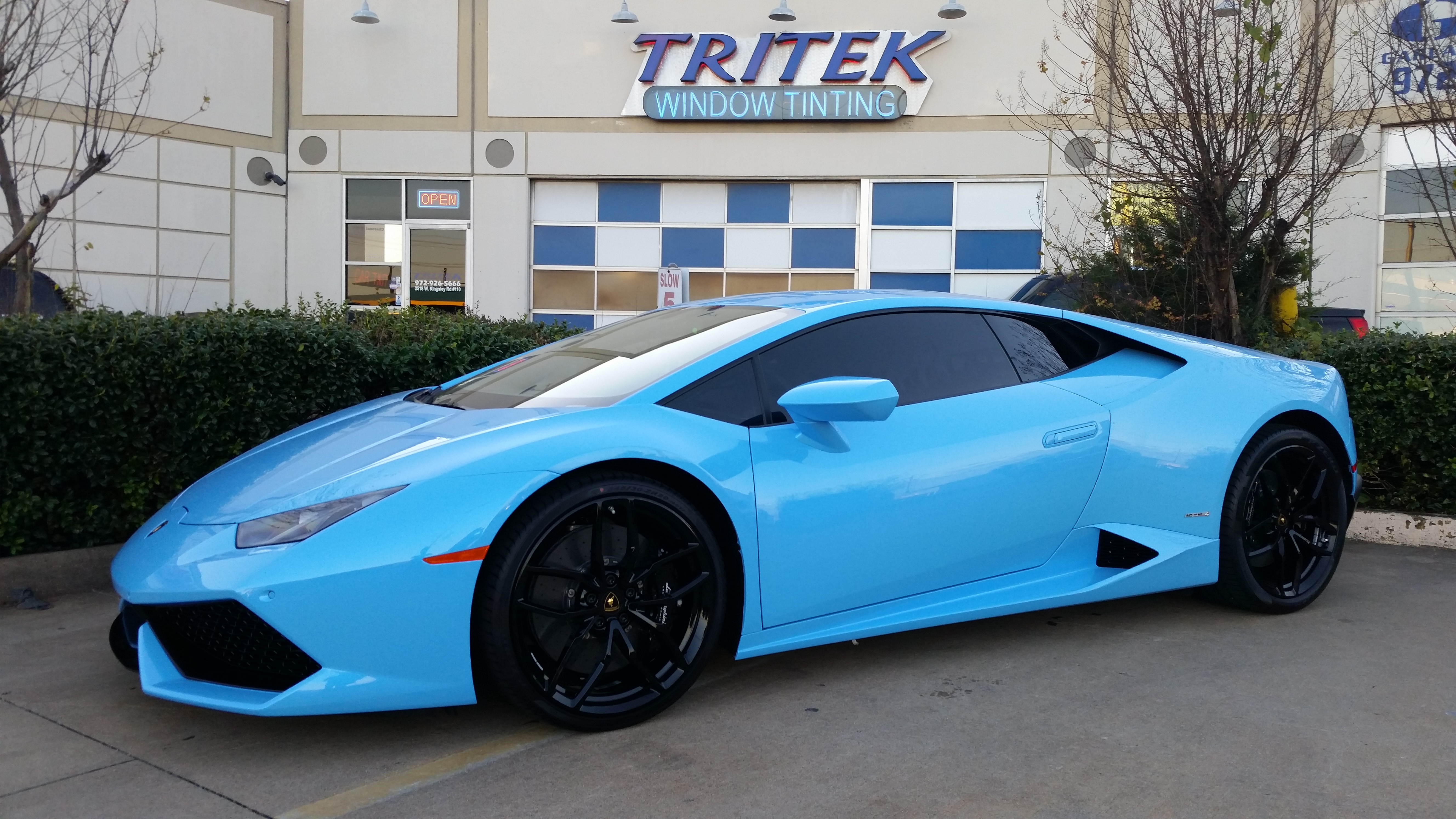 light blue car with yellow stripe